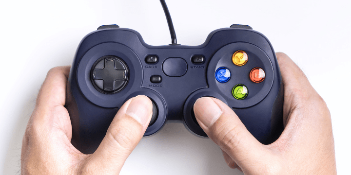 How to use VPN on Xbox. Xbox- hands are holding a joystick